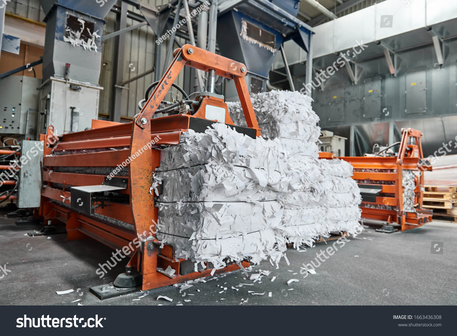 Raw materials including paper rolls, edible oils and plastic pellets in an industrial warehouse